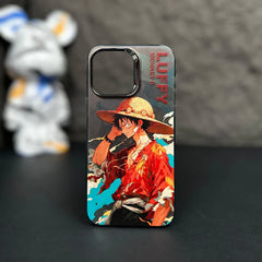 Phone case with character design on a dark surface