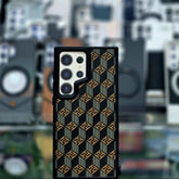 Phone case with geometric pattern on a blurred background of phone cases.
