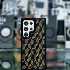 Phone case with geometric pattern on a blurred background of phone cases.
