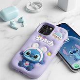 Phone case with cartoon character on a white surface with phone and earbuds.