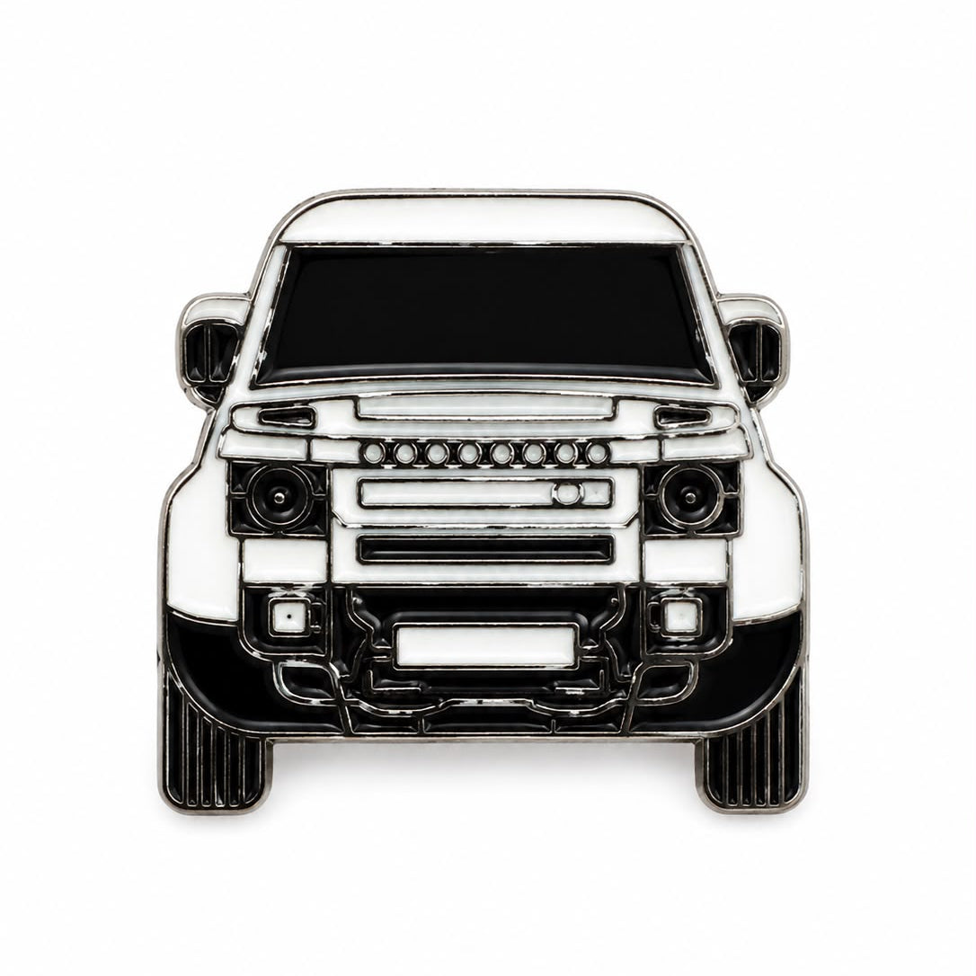 A front-facing enamel pin depicting a white SUV with black details and silver metal outlines, shown on a plain white background.