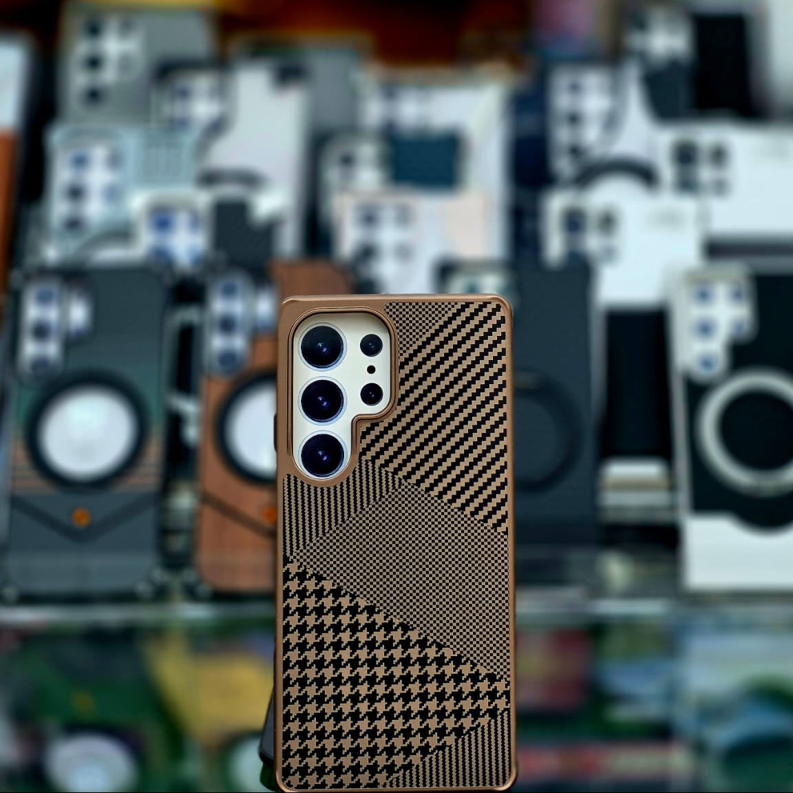 Phone case with geometric pattern on a blurred background of various phone cases