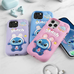 Three phone cases with Stitch design on a white surface with accessories.