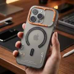 Person holding a phone case with camera design on a desk