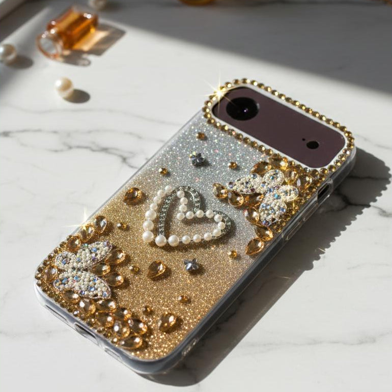 Decorative phone case with embellishments on a marble surface