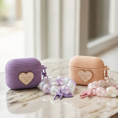 Cute Ribbed Purple AirPods Case with Heart Emblem and Beaded Wristlet Charm - Elite Phones